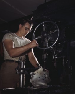 An employee in the drill-press section of North American's huge machine..., Inglewood, Calif. , 1942 Creator: Alfred T Palmer.