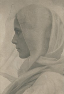 Profile portrait of woman draped with a veil, c1900.