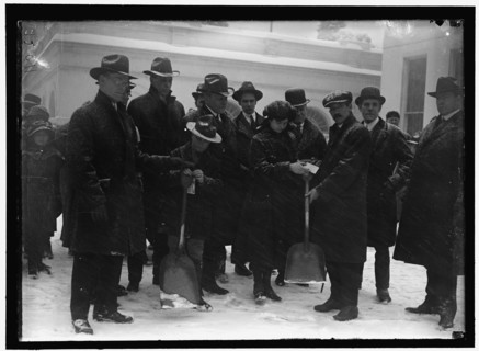 Group outside White House in snow, between 1913 and 1918.