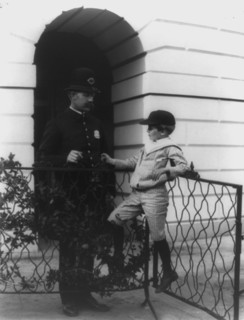 Archie Roosevelt and his friend the policeman, c1902. Creator: Frances Benjamin Johnston.