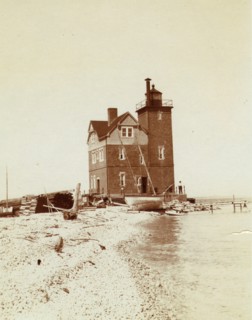View of lighthouse from beach, Duluth, Minn., 1903.