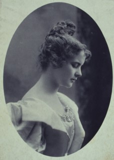 Young woman, facing right, head-and-shoulders profile portrait, c1900.