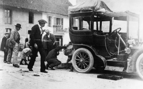 Examination of luggage on automobile, by Customs(?), France, 1905.