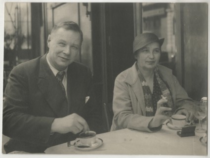 Natalia Goncharova and Mikhail Larionov at the Restaurant Petit Saint-Benoît, 1932. Private Collection.