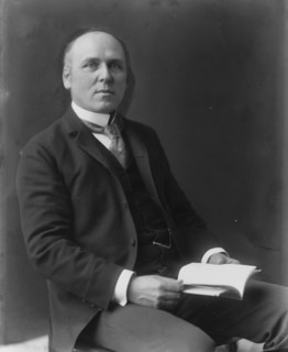 Howard Pyle, three-quarter length portrait, seated, facing slightly right, c1897.  [Artist and author].