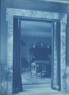 Willard Hotel - view through a curtained doorway to a lounge, between 1901and 1910.
