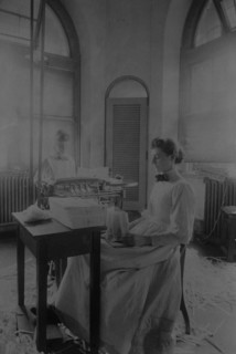 Women trimming and stacking currency sheets at the Bureau of Engraving & Printing, c1890.