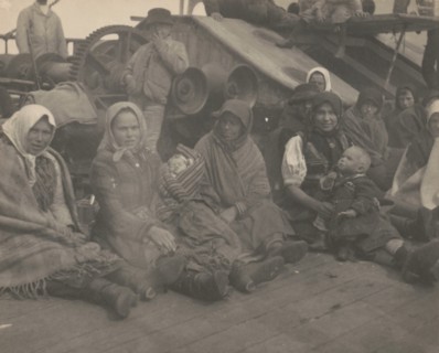 Group of emigrants (women and children) from eastern Europe on deck of the S.S. Amsterdam, 1899.