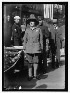 Dora Rodrigues, recruiter for service branches, possibly in front of the Cosmos Theater..., May 1917 Creator: Harris & Ewing.
