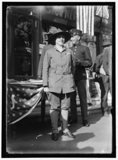 Dora Rodrigues, recruiter for service branches, possibly in front of the Cosmos Theater..., May 1917 Creator: Harris & Ewing.
