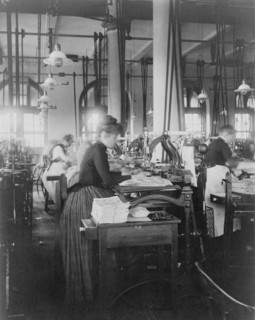 Women operating machinery at the Bureau of Printing and Engraving, Washington, D.C., 1889 or 1890.
