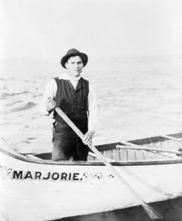 Indian guide for the rapids, standing in canoe, in the Sault Sainte Marie region of Michigan, 1903. Creator: Frances Benjamin Johnston.