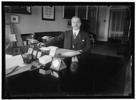 John Skelton Williams at desk, between 1913 and 1918. Creator: Harris & Ewing.