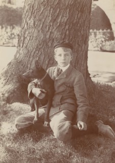Kermit Roosevelt and Jack, the dog, 1902. Creator: Frances Benjamin Johnston.