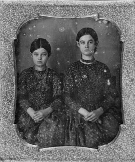 Group portrait of two unidentified girls, three-quarter length, seated, facing front, c1840 - 1860. Creator: Unknown.