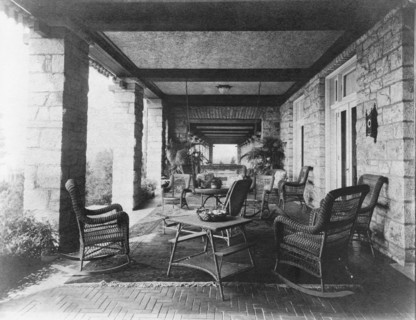 Porch of E.C. Converse house, with wicker furniture, Greenwich, Connecticut, 1908. Creator: Frances Benjamin Johnston.
