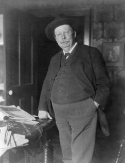 Joel Chandler Harris, three-quarter-length portrait, standing, facing slightly left, c1890 and 1910. Creator: Frances Benjamin Johnston.