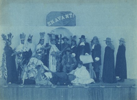 Pageant participants costumed as Pilgrims and Natives, posed beneath a banner "En..., c1880 - 1900. Creator: Frances Benjamin Johnston.