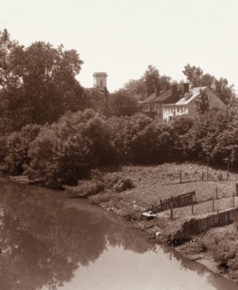Houses on Water Street, from the bridge, Fredericksburg, Virginia, between 1927 and 1929. Creator: Frances Benjamin Johnston.