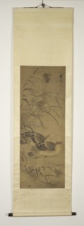 Two ducks under reeds.