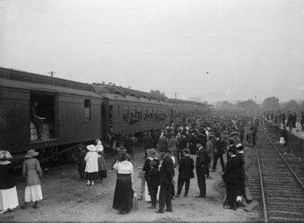 Army, U.S. Troops In Training, 1917. Crowds waving off a train packed with soldiers.