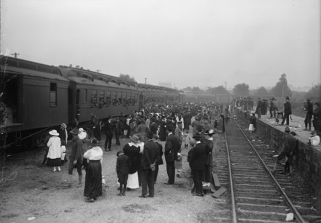 Army, U.S. Troops In Training, 1917. Crowds waving off a train packed with soldiers.