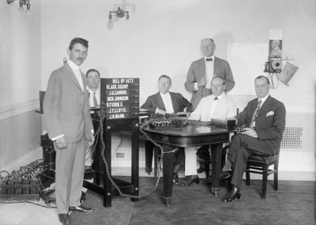 Bobroff Voting Machine - Being Considered For Use In House, Standing Right To Left: Reps..., 1917. Creator: Harris & Ewing.