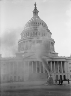 U.S. Capitol - Cleaning Exterior, 1913. Machinery in foreground, hose connected to water main.