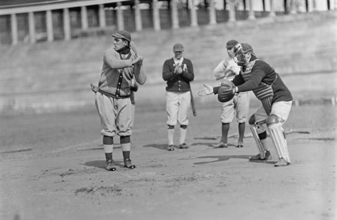 Jack Calvo at Bat, Vic Bickers (Maybe) in Dark Sweater Holding Bat, Al Scheer Left of..., ca. 1913. Creator: Harris & Ewing.