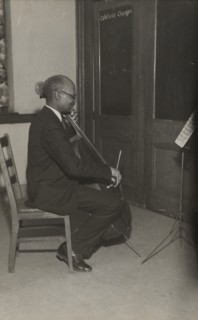 A cello student of the Adult Education Classes under the Federal Music Project at Carlton YMCA, 1936.
