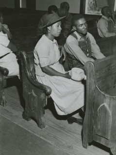 African Americans sitting in pews at a meeting of Farm Security Administration borrowers..., 1941. Creators: Farm Security Administration, Jack Delano.