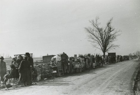 Evicted African American sharecroppers standing with their belongings along Highway 60..., Jan 1939. Creators: Farm Security Administration, Arthur Rothstein.