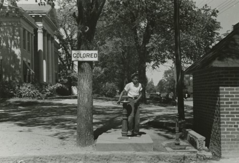 Drinking fountain on the county courthouse lawn, Halifax, North Carolina, 1938-04. Creators: Farm Security Administration, John Vachon.
