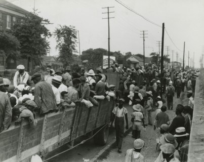 Cotton hoers loading at Memphis for the day's work in Arkansas; June, 1937. Creators: Farm Security Administration, Dorothea Lange.
