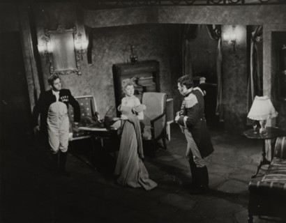 Two men and woman in evening dress, 1938.