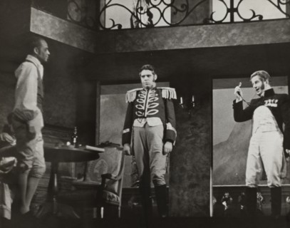 Three men, one with monocle, 1938.