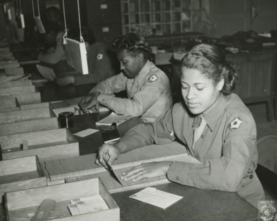 Members of the Women's Army Corps identifying incorrectly addressed mail for soldiers..., 1943. Creator: Unknown.