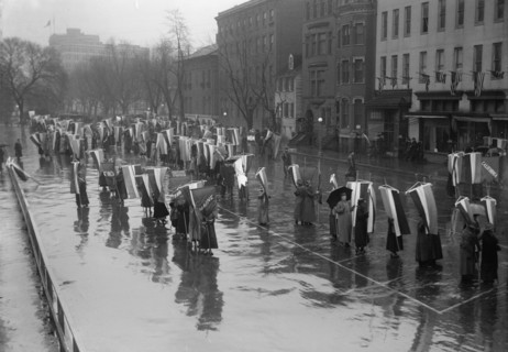 Woman Suffrage - Marching in Rain, 1917. Creator: Harris & Ewing.