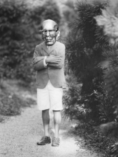 Person wearing a mask made by W.T. Benda, 1925 Sept. 20. Creator: Arnold Genthe.