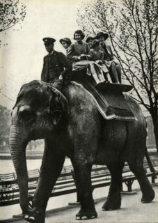 'At the London Zoo - enjoying a ride on an elephant', 1939, (1947).  Creator: Unknown.