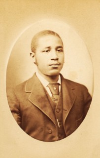 Studio portrait of a young man wearing tie and stick pin, c1880-c1889. Creator: M Stahn.