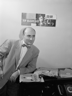 Portrait of George Avakian in his office or home, New York, N.Y.(?), 1938. Creator: William Paul Gottlieb.