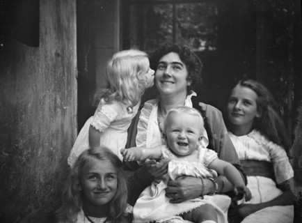Unidentified woman with four children, portrait photograph, between 1911 and 1942. Creator: Arnold Genthe.