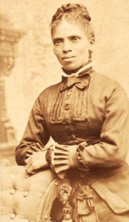 Studio portrait of unidentified woman, arms on back of chair, c1880-c1889. Creator: Richmond Photograph Co.