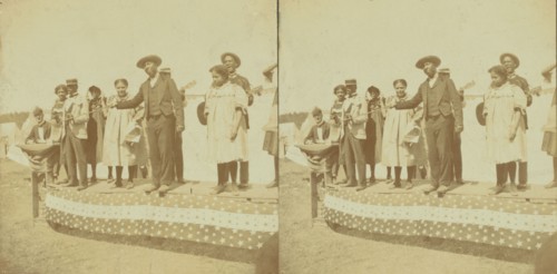 A side show at Chatham Fair, [Musical performers on a small outdoor stage], (1868-1900?). Creator: Unknown.