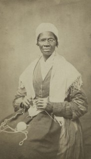 Portrait of abolitionist Sojourner Truth, sitting with yarn and knitting needles, 1864. Creator: JH Preiter.