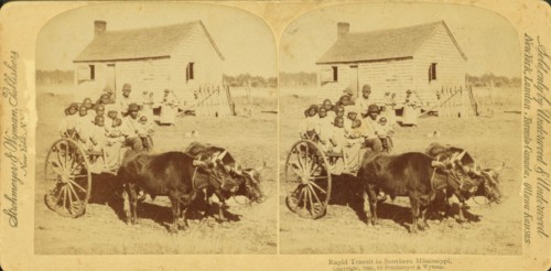Rapid transit in southern Mississippi, [Large group of children on an oxcart], (1868-1900?). Creator: Unknown.