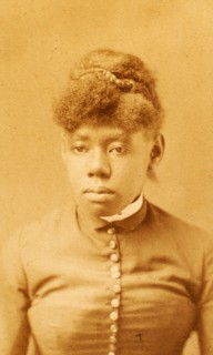 Portrait of unidentified young woman with buttoned bodice and band collar, (1880-1889?). Creator: H. A. Insley.