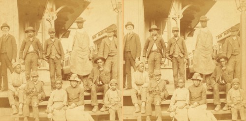 Simplicity, Alabama, U.S.A. [Group gathered on a porch, in town], (1868-1900?). Creator: Benjamin West Kilburn.