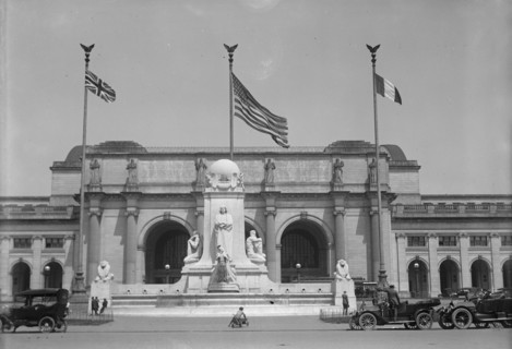 Flags - American, British, And French Flags in Front of Union Station, Awaiting Arrival..., 1917. Creator: Harris & Ewing.